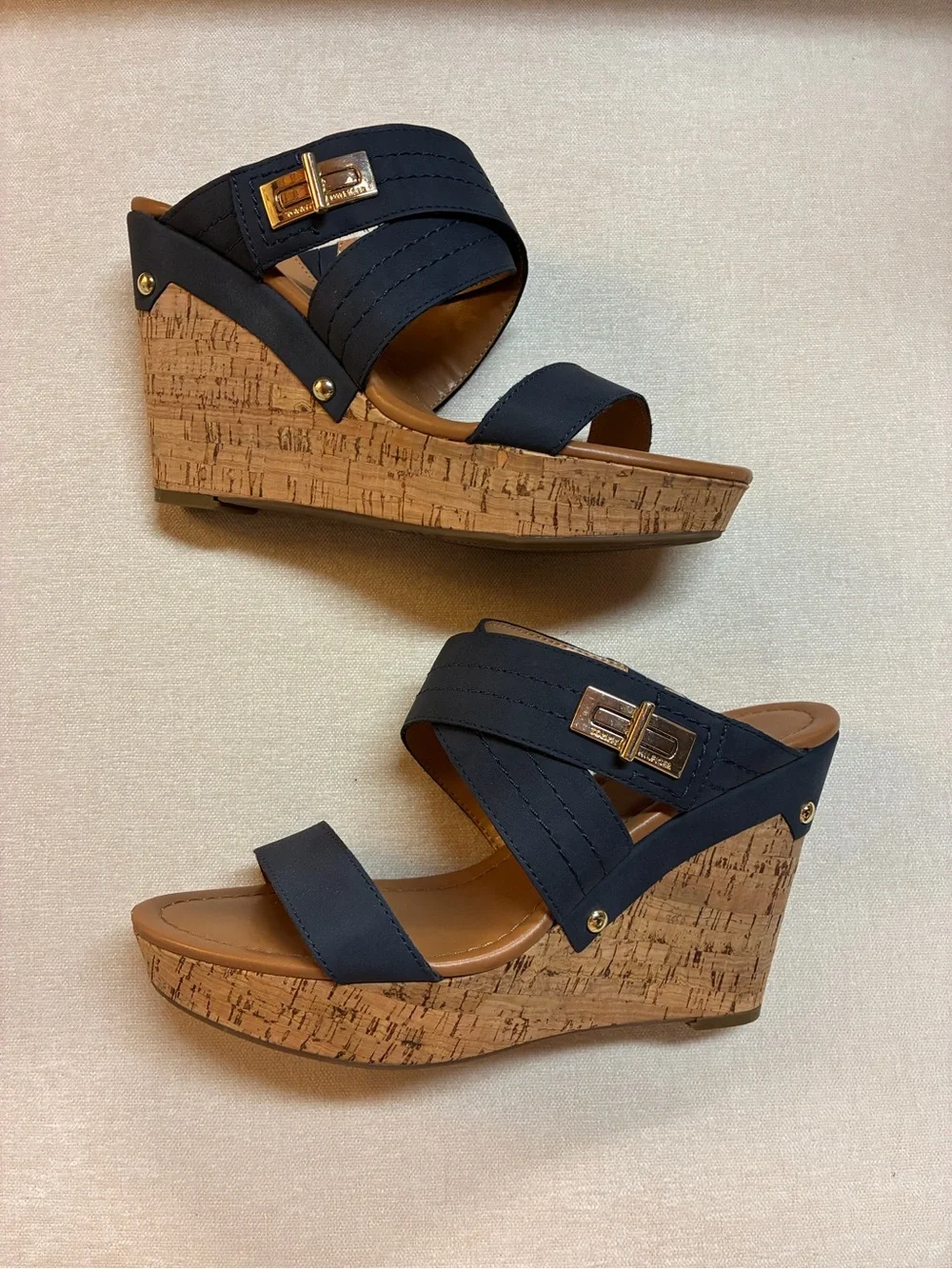 Tommy Hilfiger women’s cork wedge slide sandals with gold-tone logo hardware